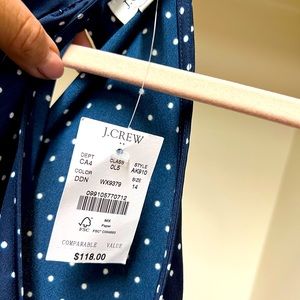 Navy and white polka dot jumpsuit, with halter neck. Size 14.